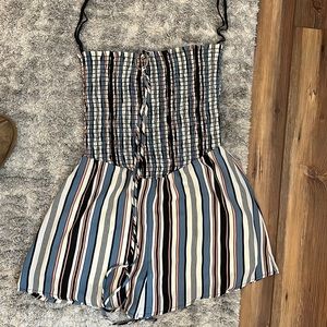 multi-colored romper with strings to tie around the neck